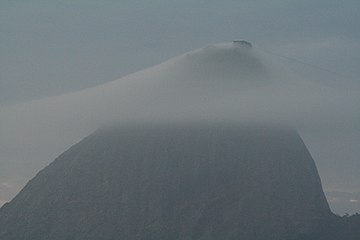 Sugarloaf Mountain, Brazil at dawn with fog layer partially obsuring cable car facility